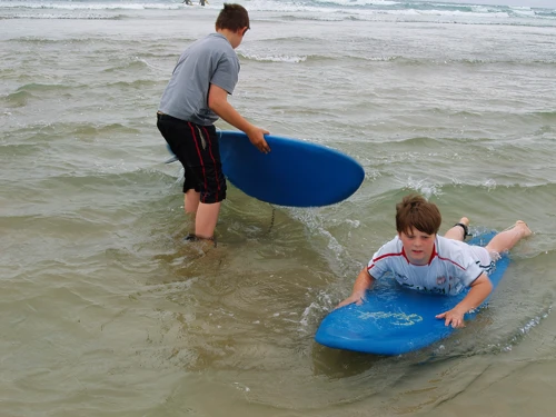 Zac and Ashley get to grips with our rented surf boards at Perranporth